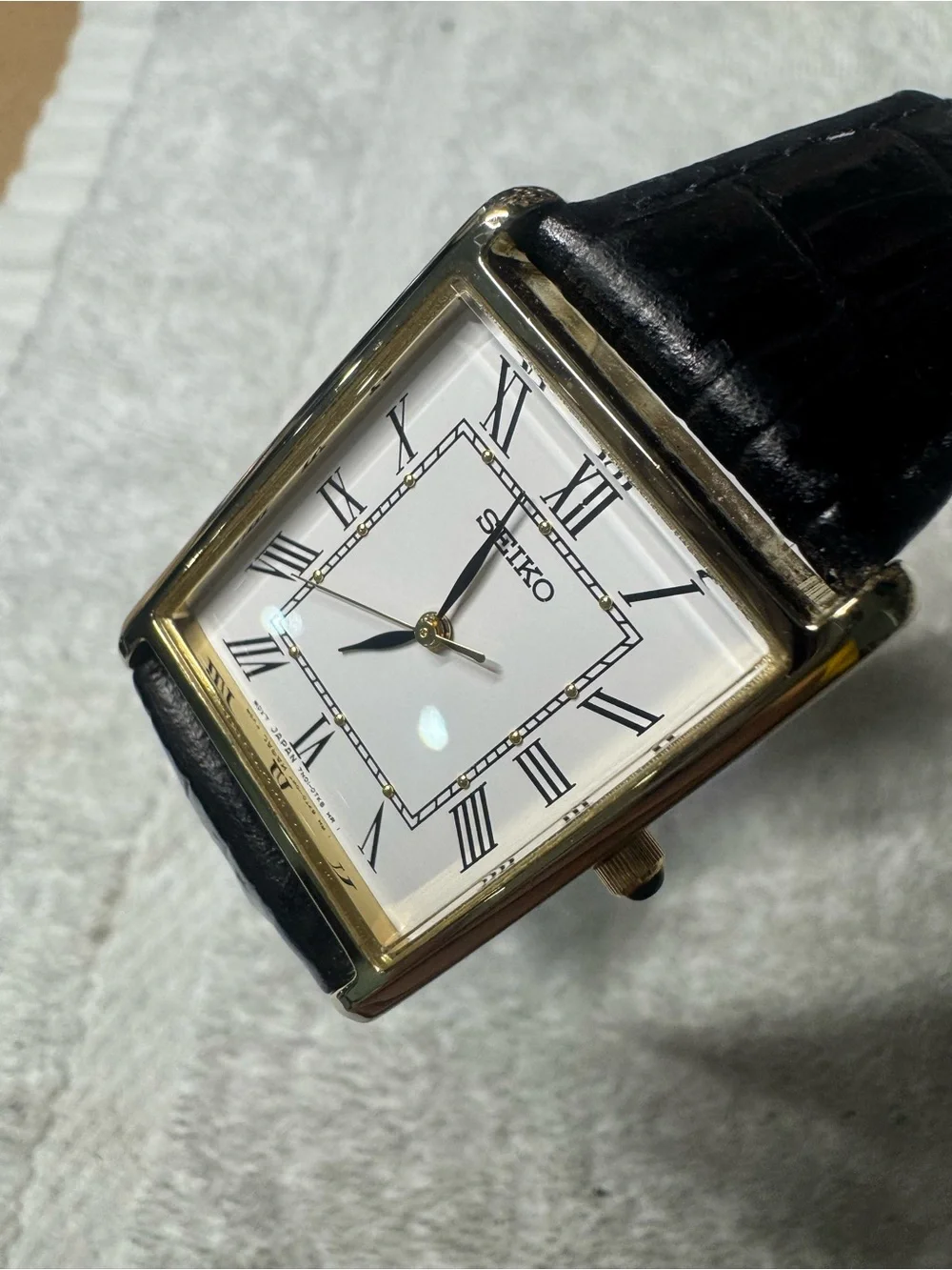 Seiko White Dial Watch with Black Strap and Gold Accents